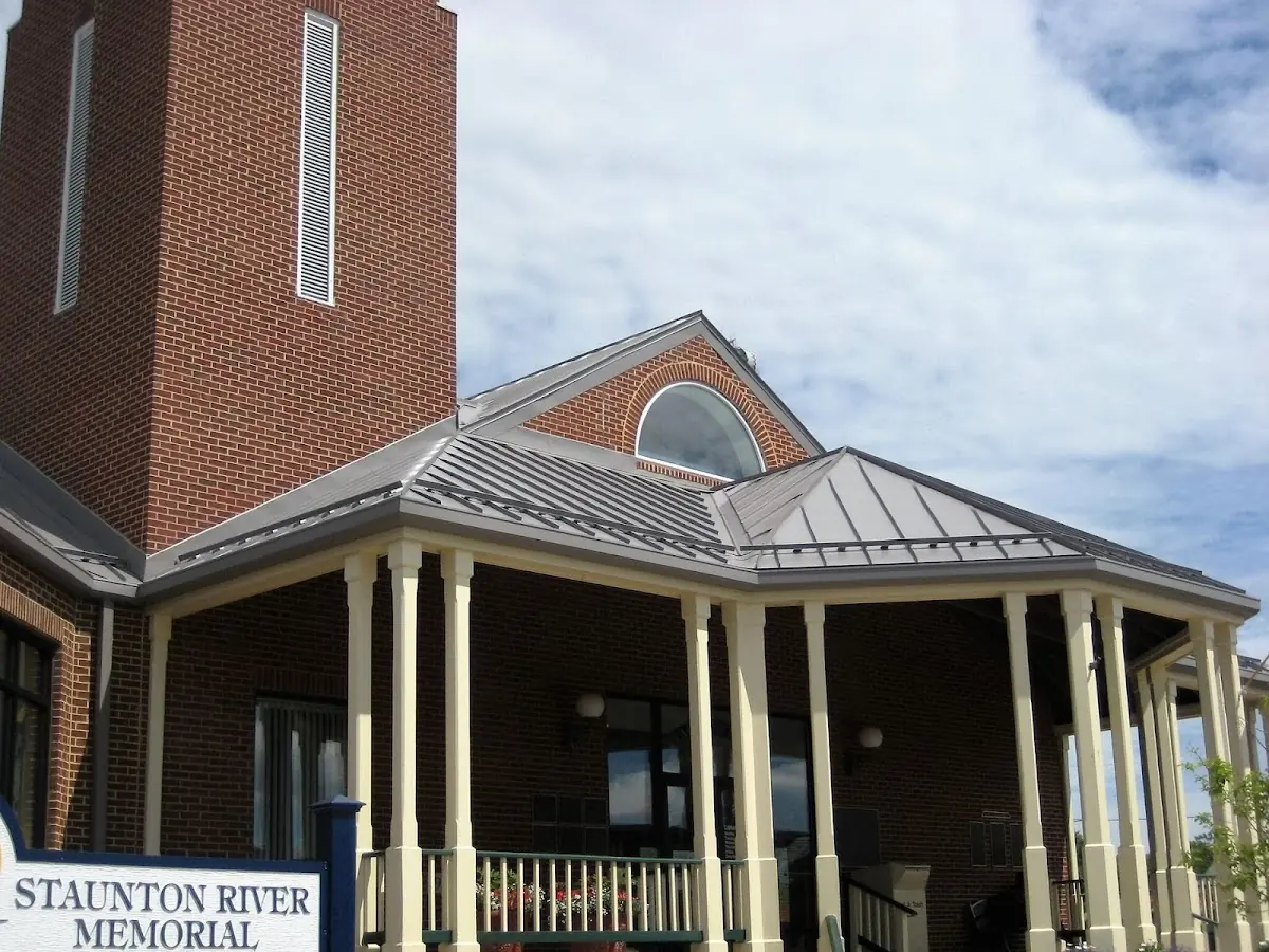 Skilled roofing craftsmen working on a residential roof in McAlester